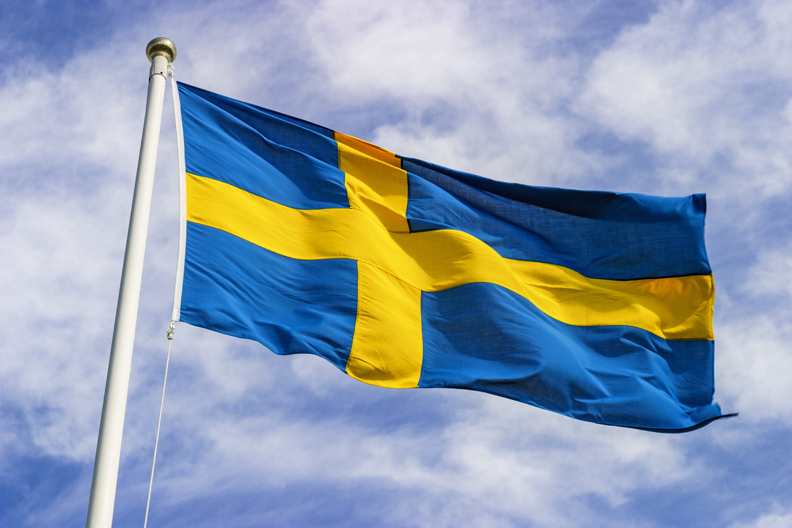 Swedish flag waving in the wind in the sky