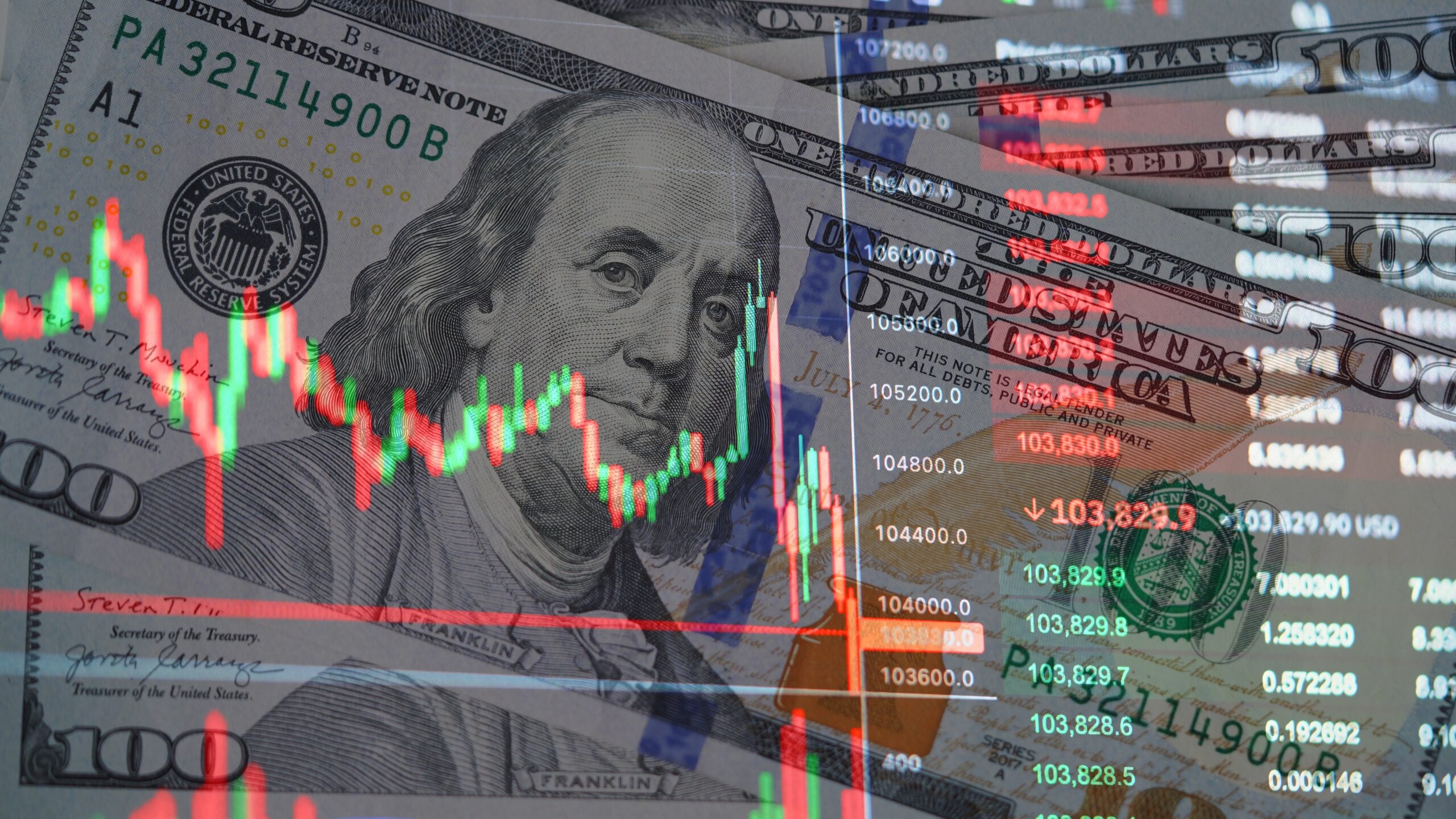 Stock market crash concept with candlestick chart over US dollar banknote